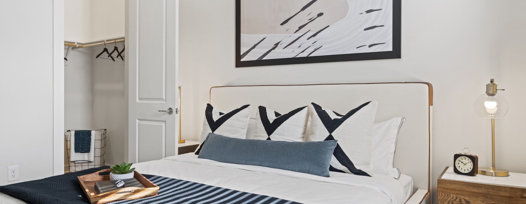 a bedroom with a bed and a nightstand